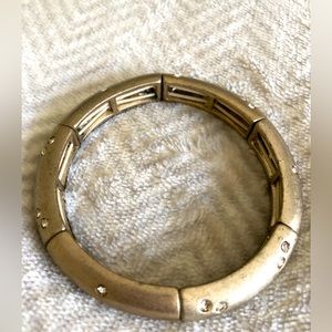 Shiny gold coloured bracelet with rhinestones, stretchy, 2.5 inches